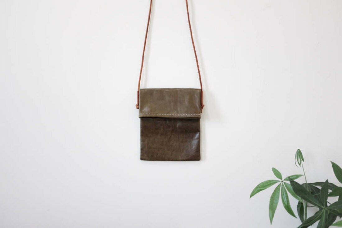 Fold-over crossbody bag in olive from Small Queue