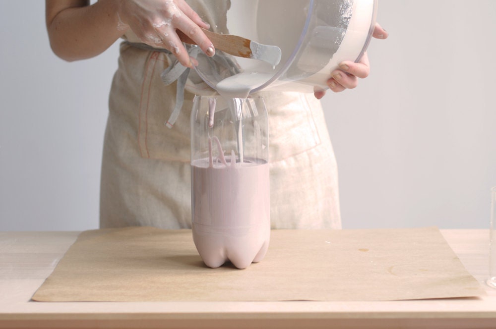 Pouring the plaster into the mold