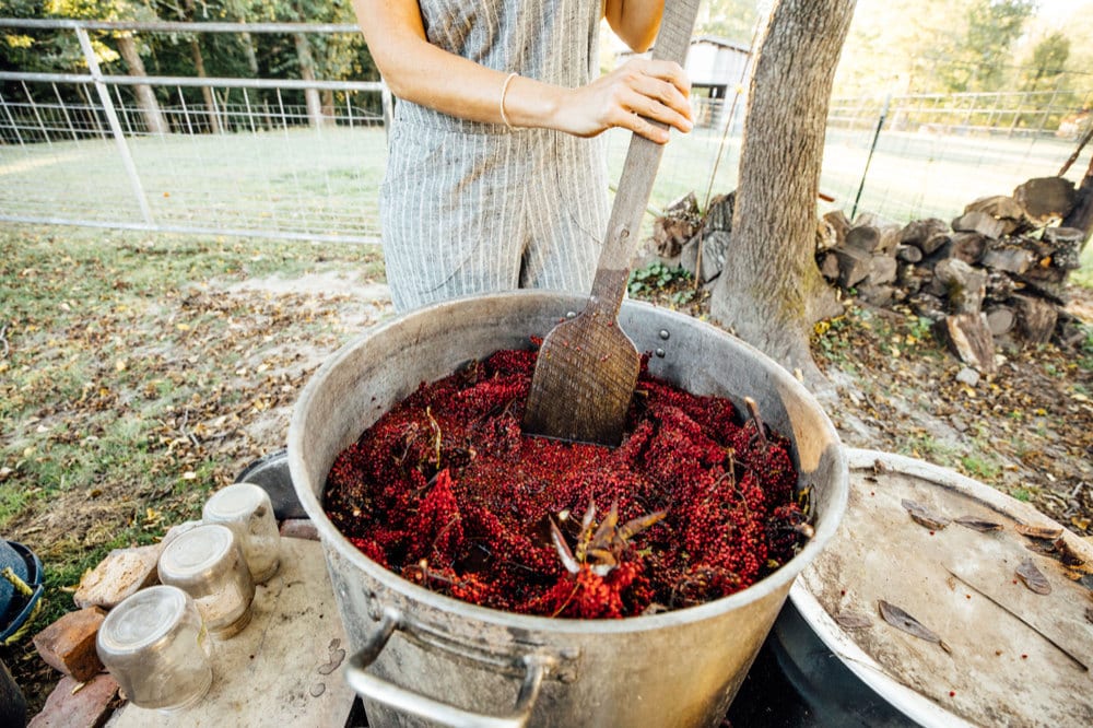 Kacie stirring a dye vat