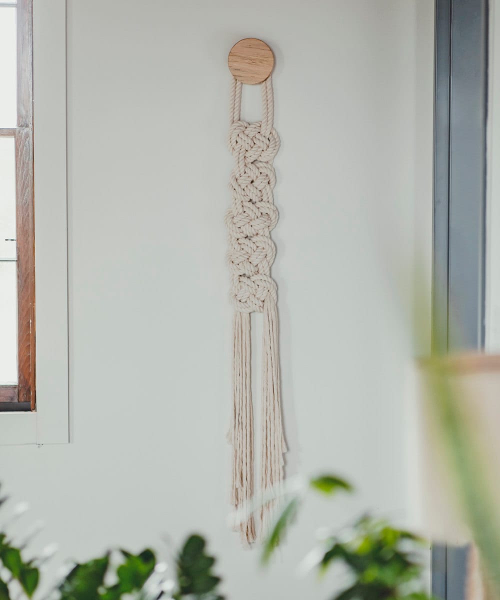 "Scala" macrame fiber art with wooden accent knob from Candice Luter.