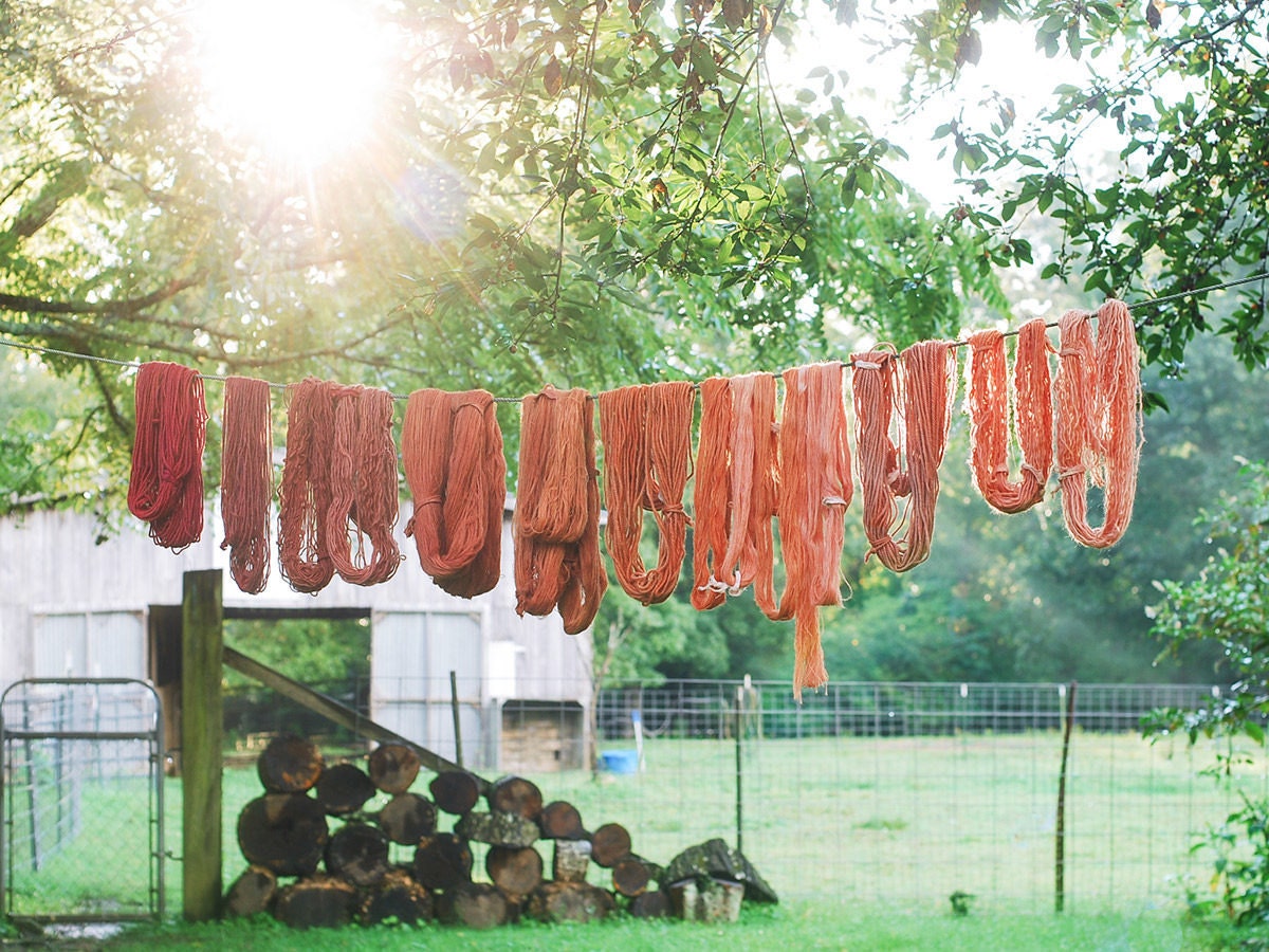 Naturally dyed yarn hanging outside to dry