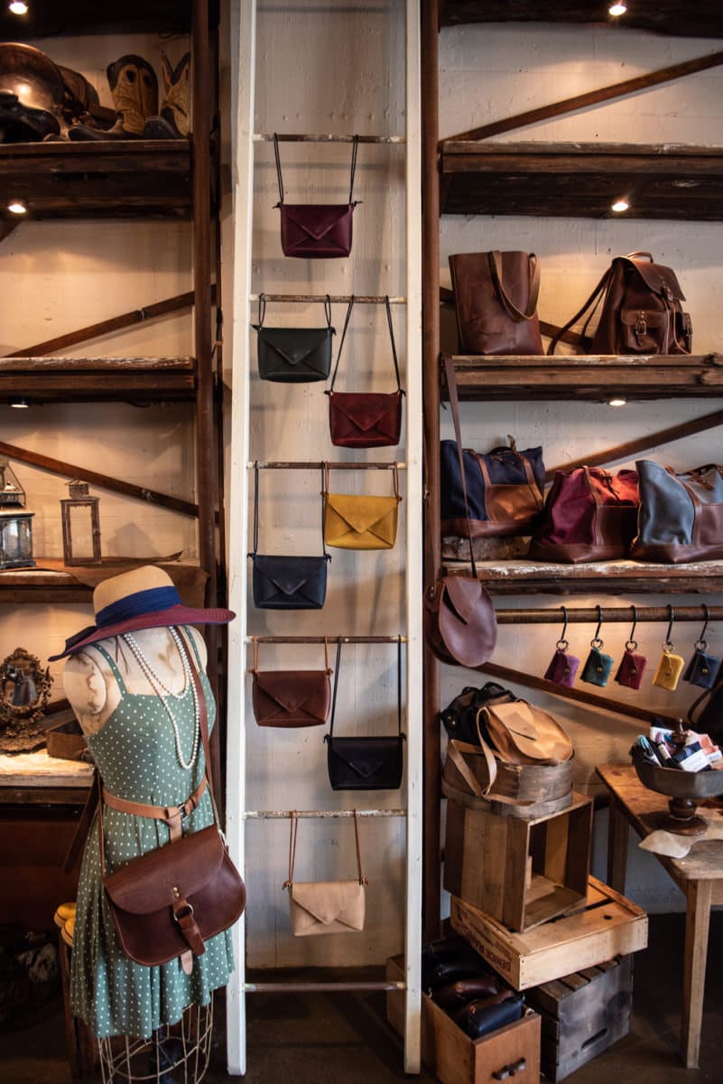 Purses, bags, and wallets on display inside the Holtz Leather Co. brick and mortar.