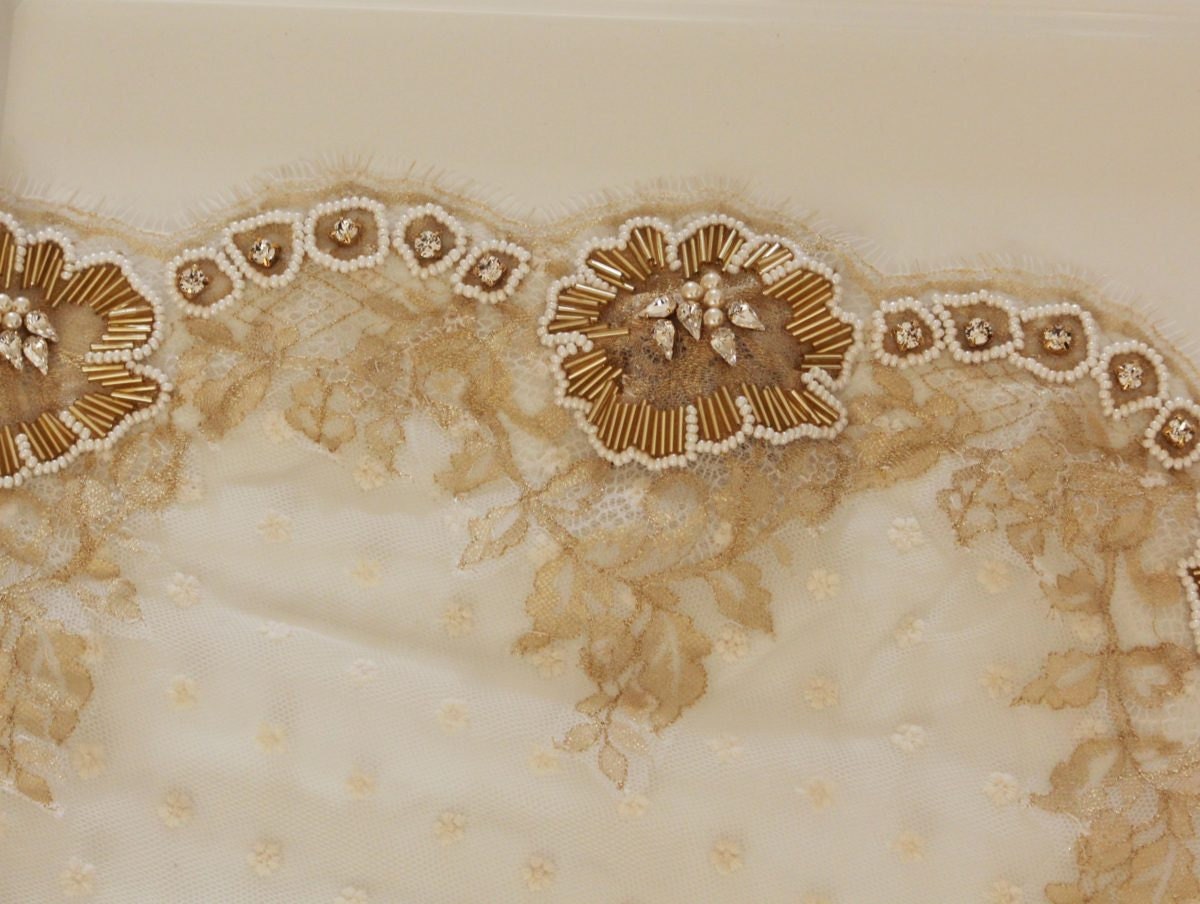 Details of the gold lace embellishments on a mantilla veil