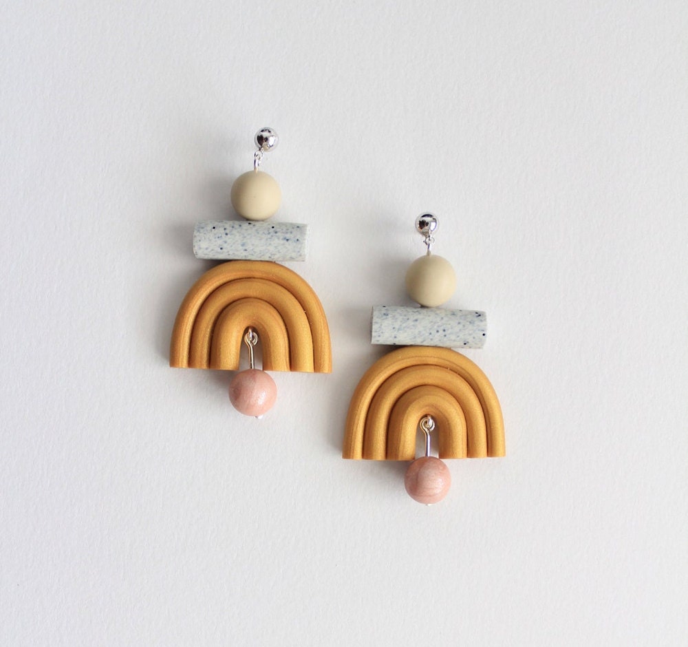Gold geometric rainbow earrings from TSUNJA