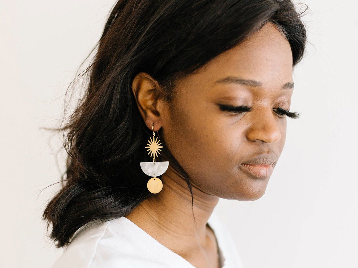 Starburst earrings on a model.