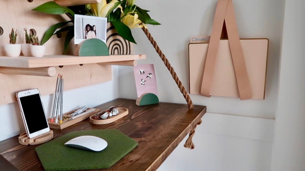 A custom floating desk from Endless Furniture on Etsy, accessorized with some of Janea's favorite home office finds.