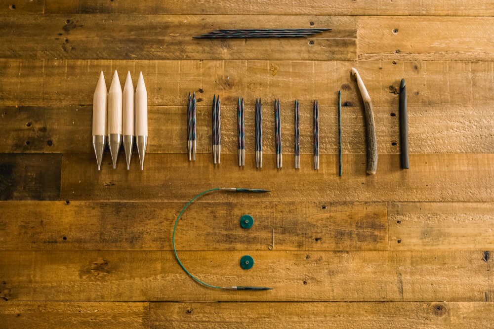 Nathan's knitting supplies laid out on a table