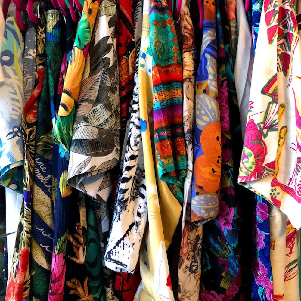 A closeup of the detail on a rack of Halima's patterned vintage pieces.