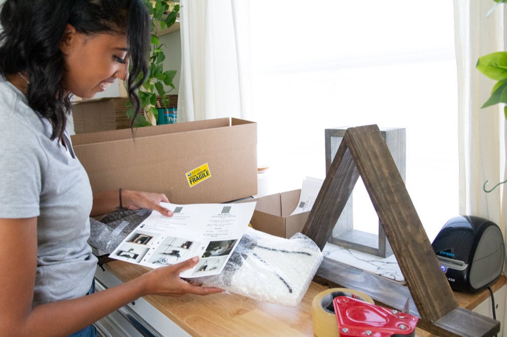 Ilana works on packing orders for shipment.