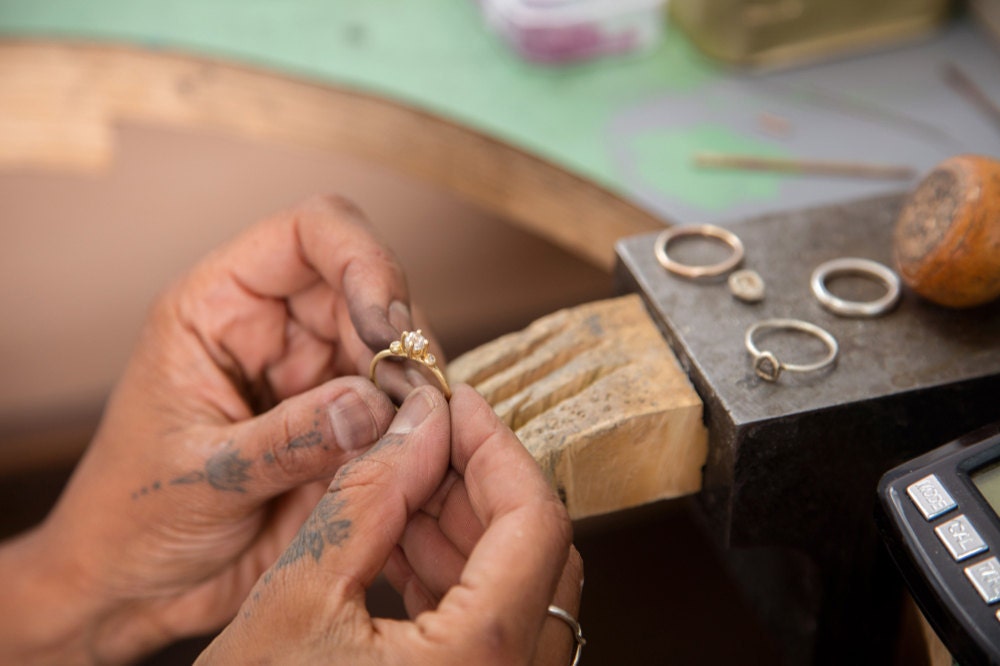 Tamara Gomez holding a finished raw diamond ring