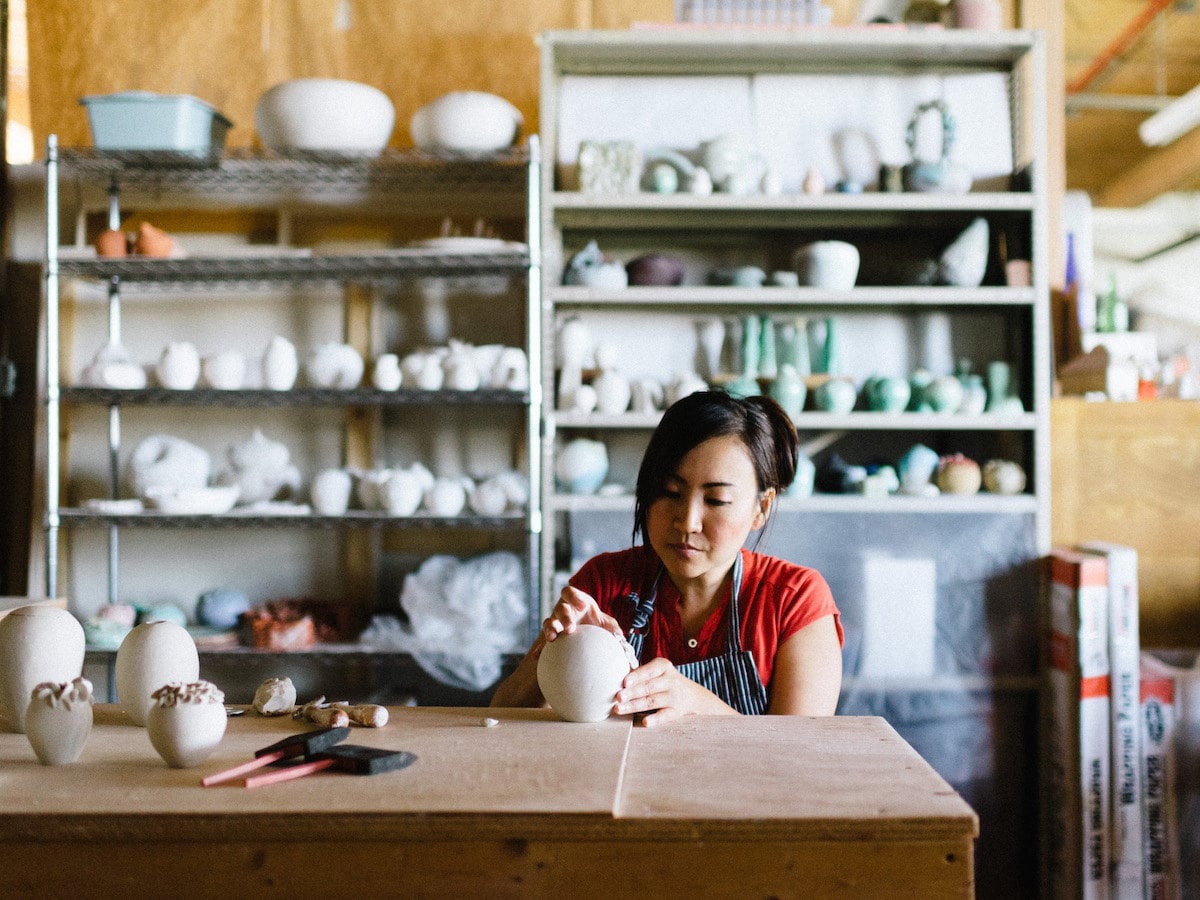 Echo of Nature seller Yumiko Goto making pottery in her studio.