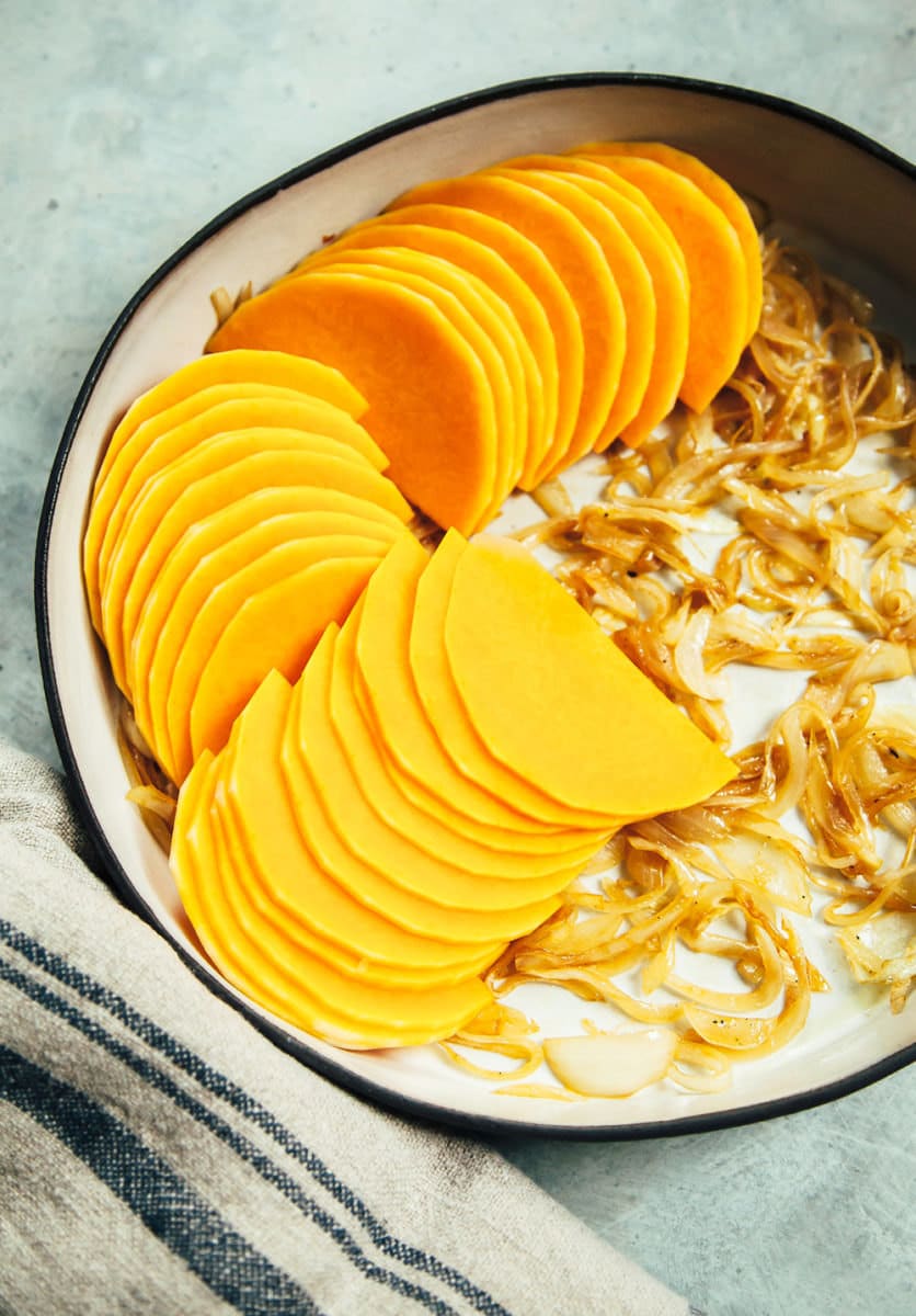 Squash and onions in the pan, ready for baking