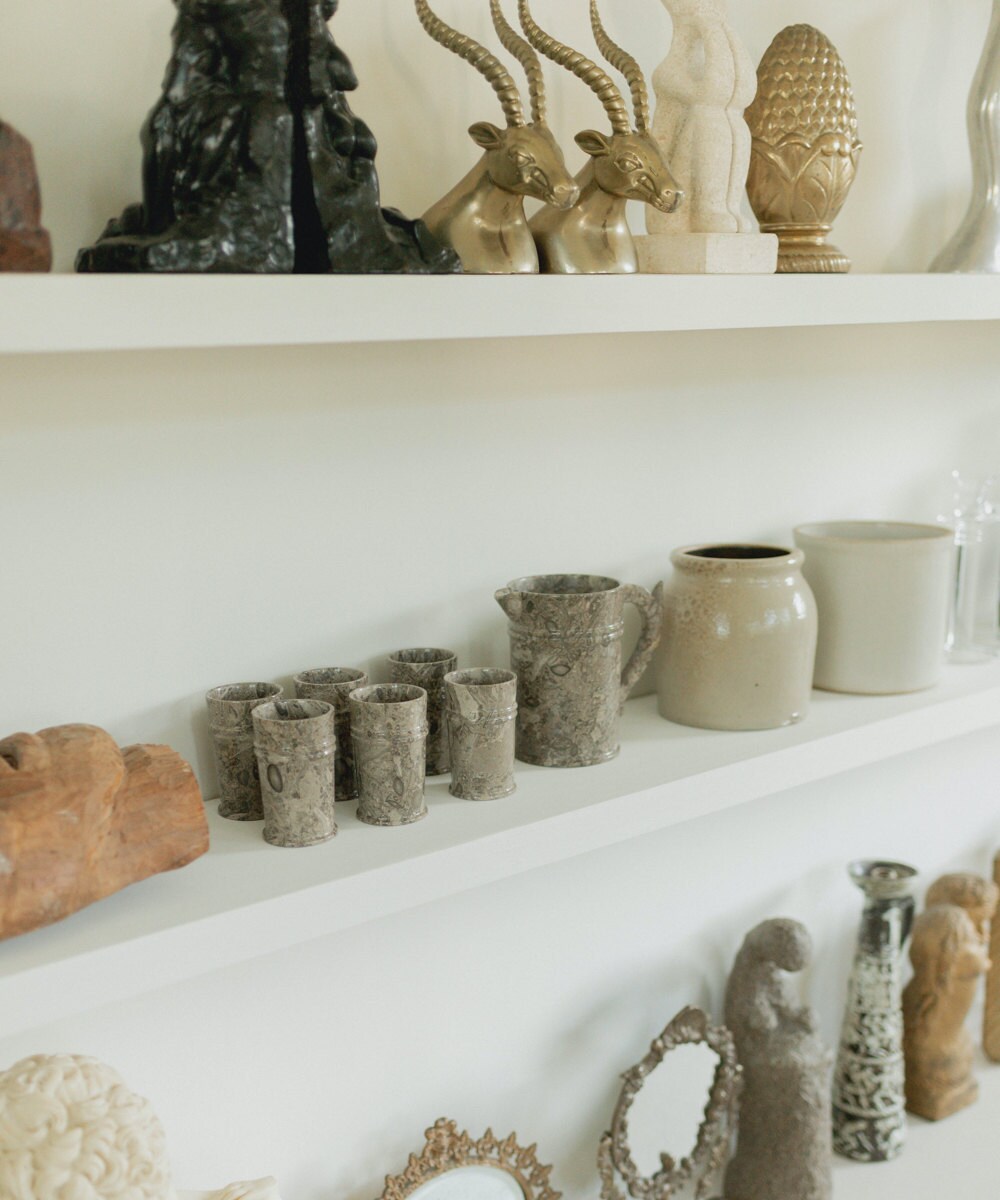 A closeup of the vintage objects on Mara's shelves.