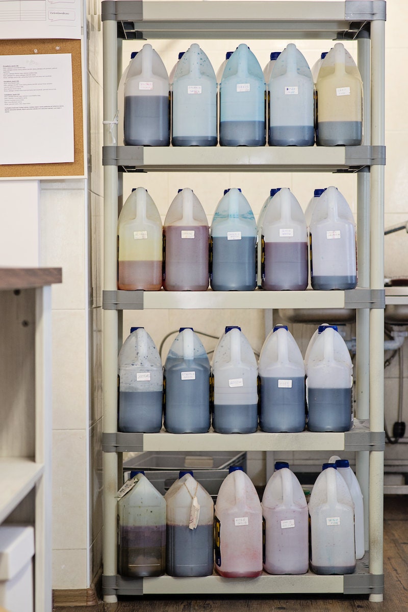 Bottles of colorful dye in the Wardrobe by Dulcinea studio