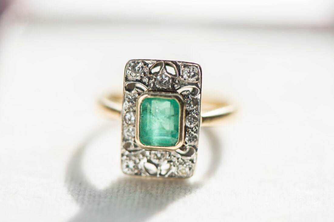 An emerald and diamond engagement ring from KK Vintage Collection
