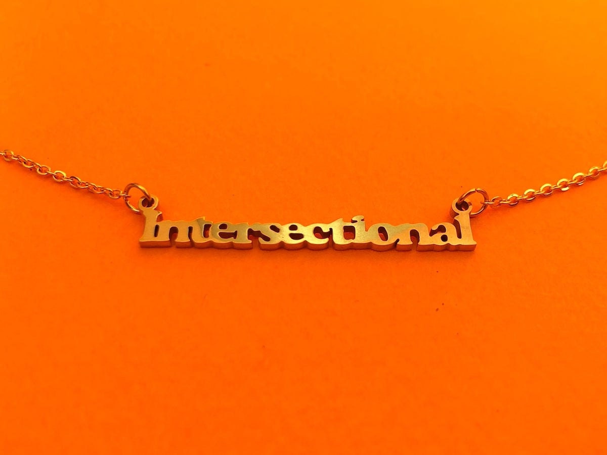 Intersectional feminist nameplate necklace from Brownie Points on Etsy