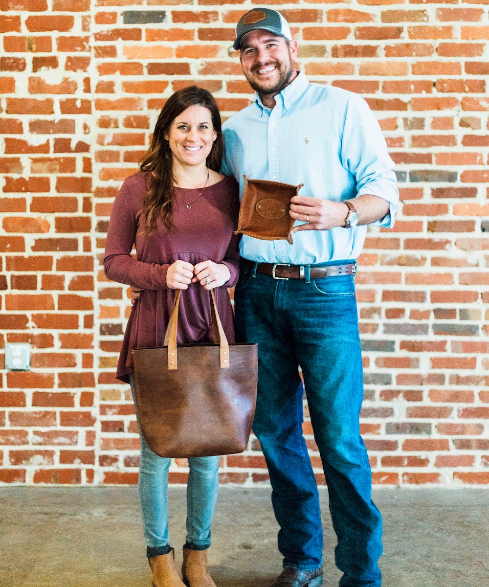 Portrait of Holtz Leather Co. shop owners Coleen and Rick Holtz.