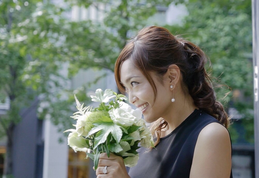 Rino picking out flowers for her candles at the flower market.