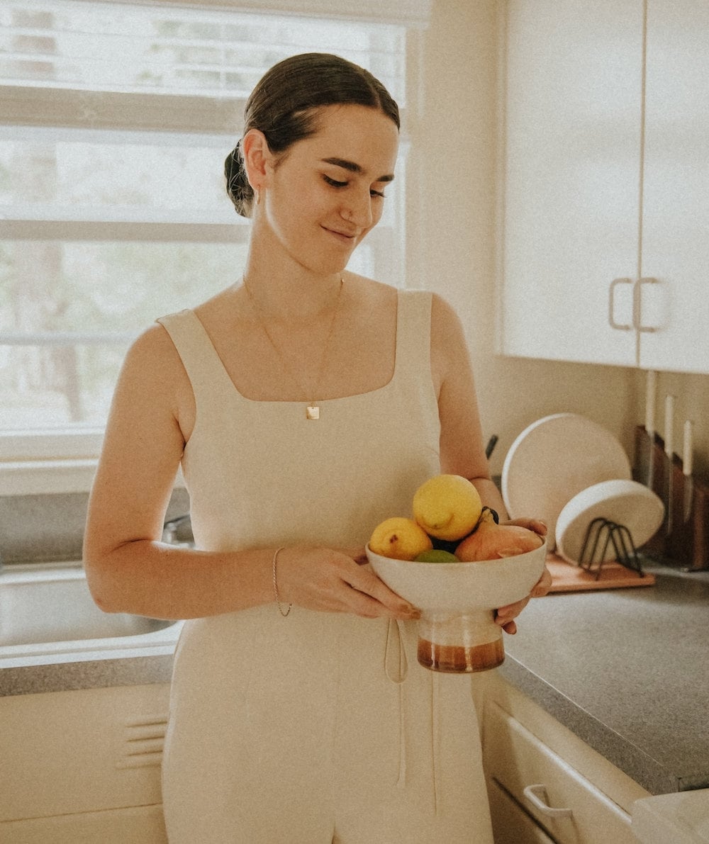 Tonya holding a fruit bowl