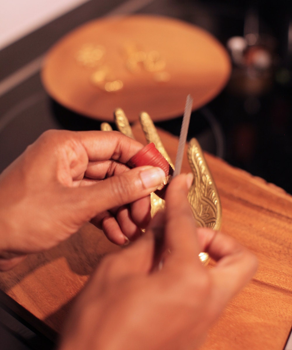 Ashley works on shaping a gold ring