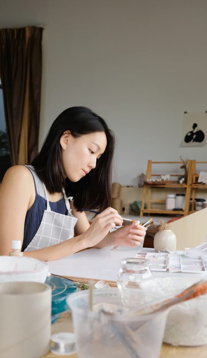 Chien Nie at work in her studio