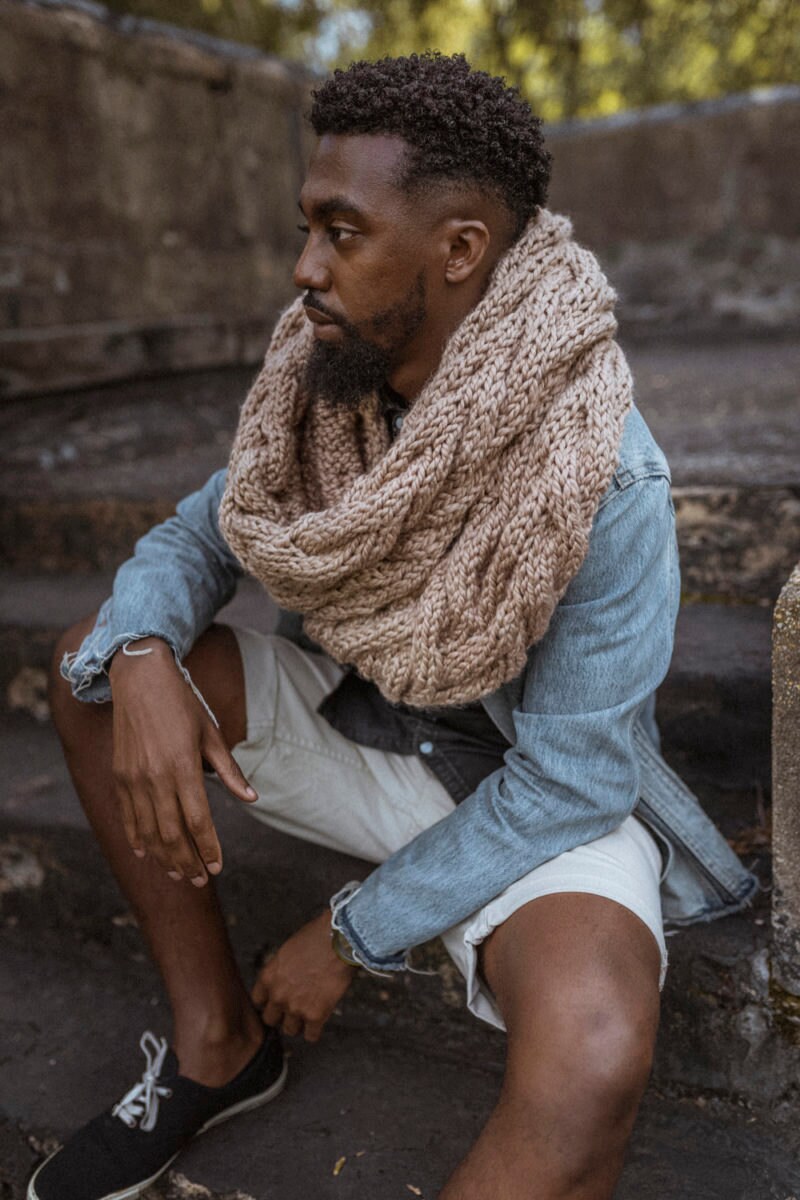 Nathan models a hand-knit cowl