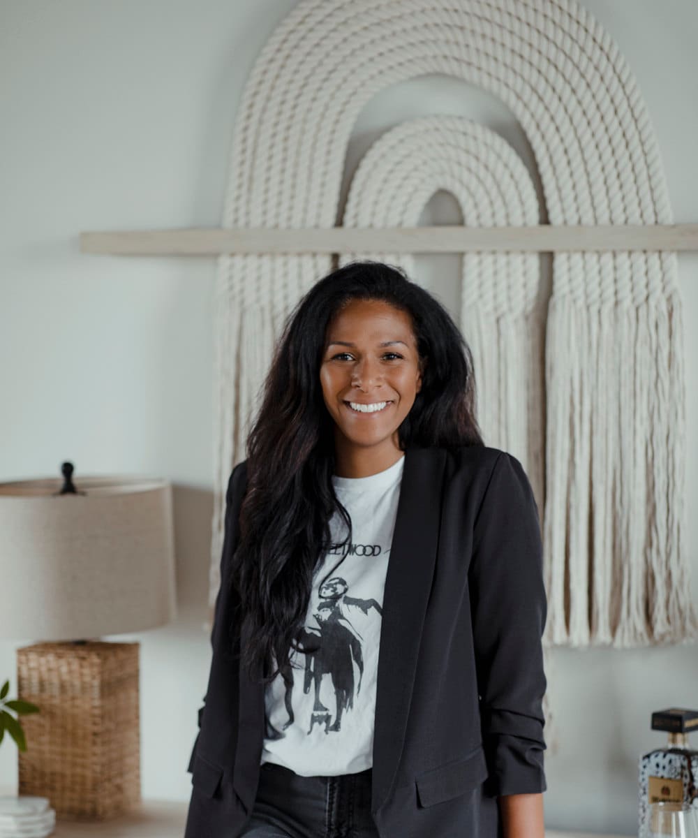 A portrait of fiber artist and shop owner Candice Luter in her showspace.