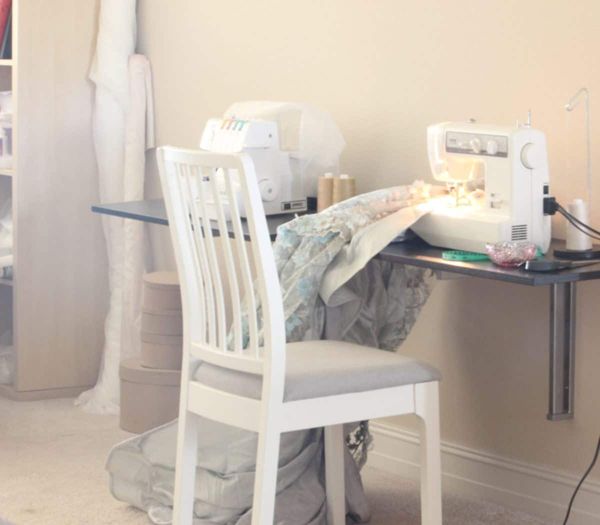 Smitha's workstation with a dusty blue bridal skirt in progress