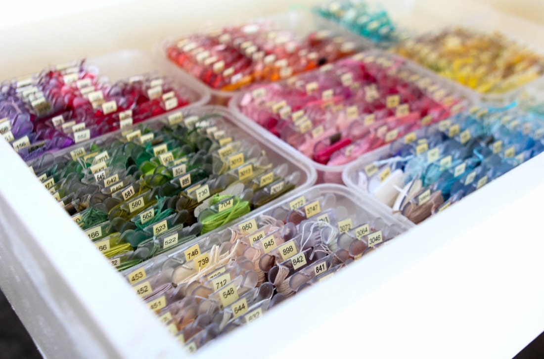 Ruby's extensive collection of embroidery floss, organized by color in a drawer