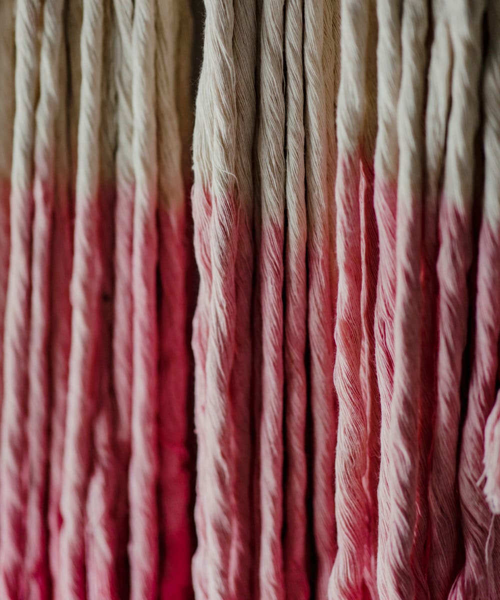 A closeup of pink dip-dyed fibers.