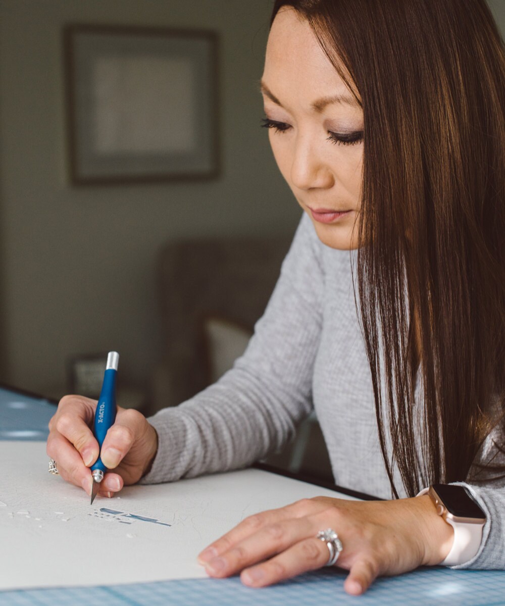 Karen working on a paper-cup map in her studio