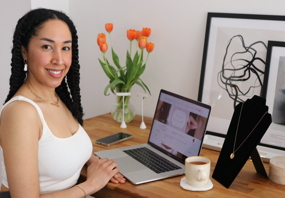 A portrait of EVREN shop owner Sabrina Caldwell at her desk, in her Vancouver, CA studio.