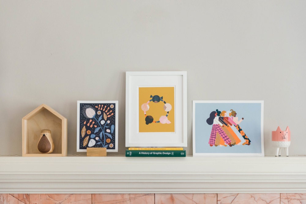 A mantel decorated with Meenal's colorful prints.