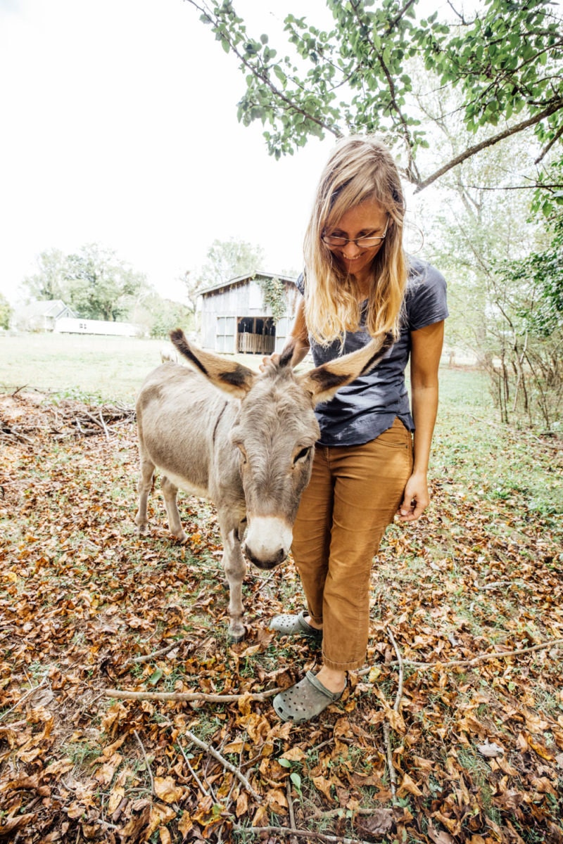 Kacie with one of her miniature donkeys