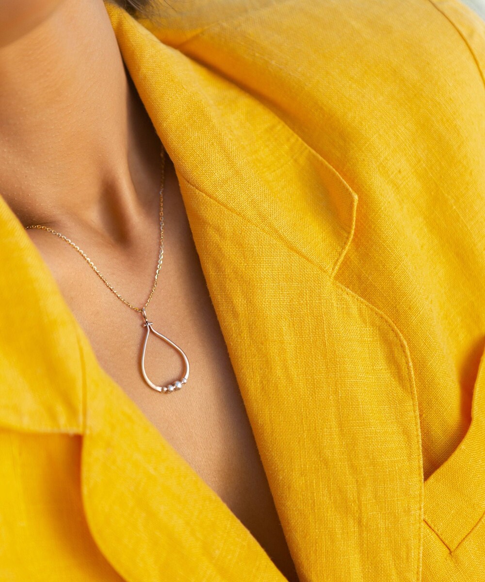 14k gold and silver teardrop pendant necklace from Aleishla