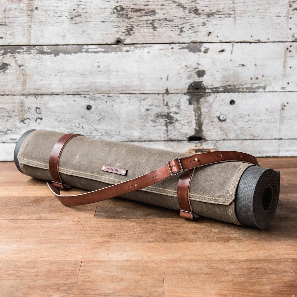 A waxed canvas yoga mat carrier from Peg and Awl