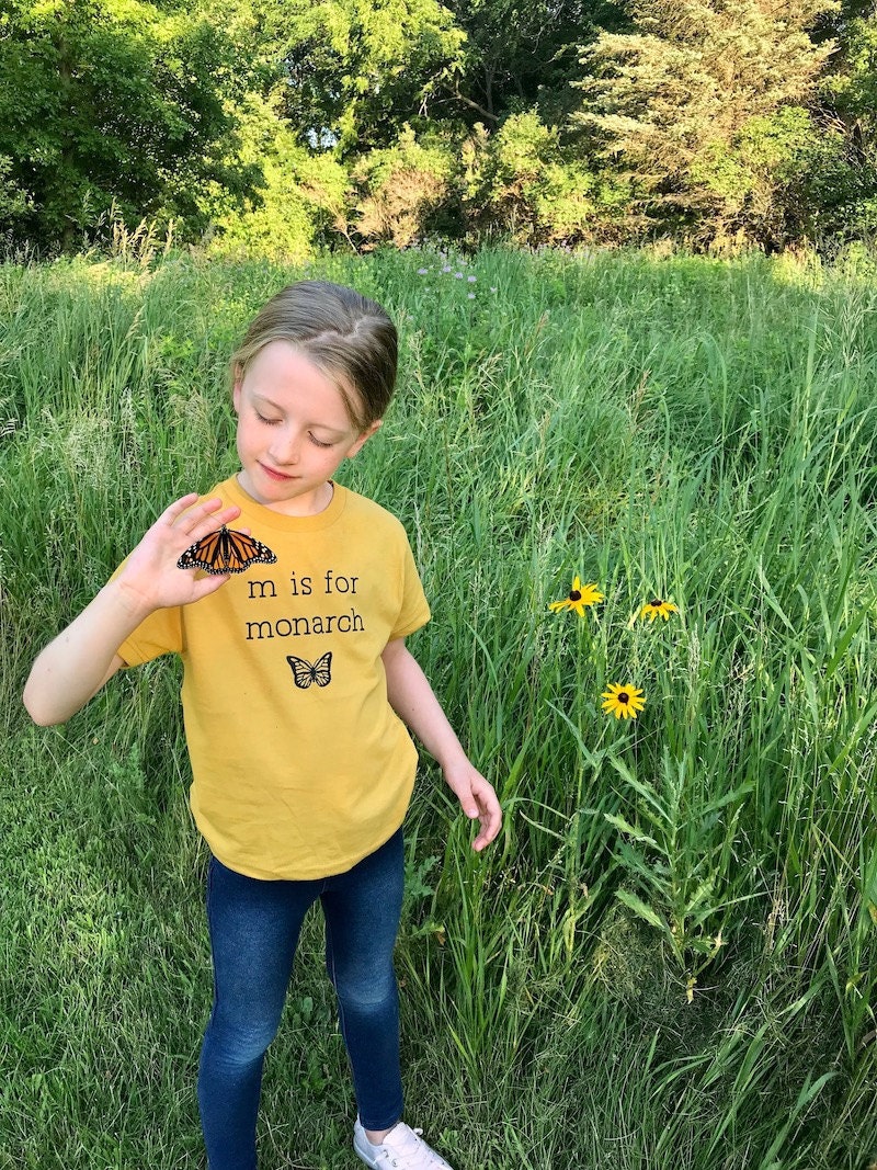 Lindsey's daughter Haddie wears a "M is for Monarch" shirt