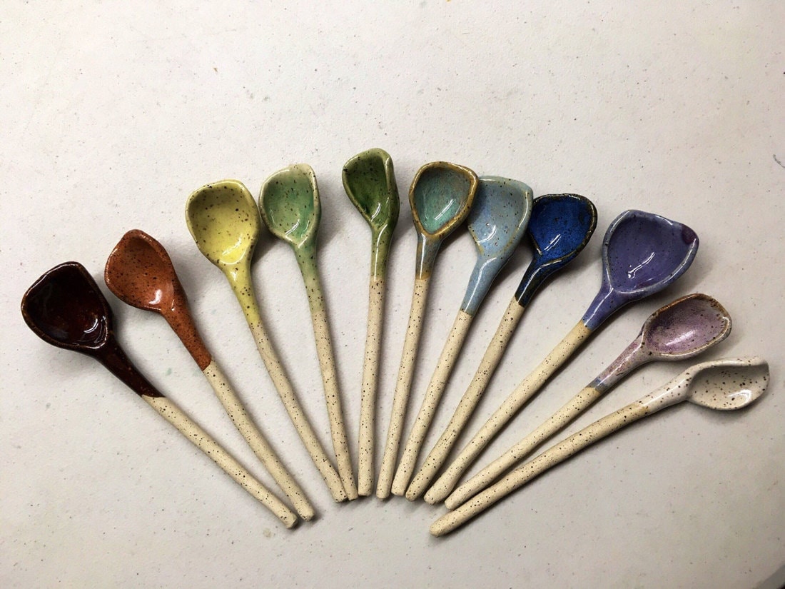 A rainbow-glazed ceramic spoon set from Amrita Lash Pottery.