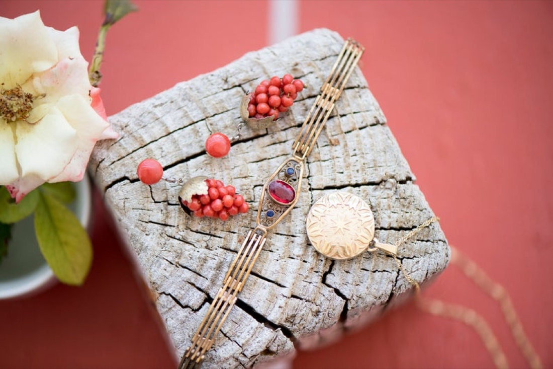 A bracelet, earrings, and locket from KK Vintage Collection