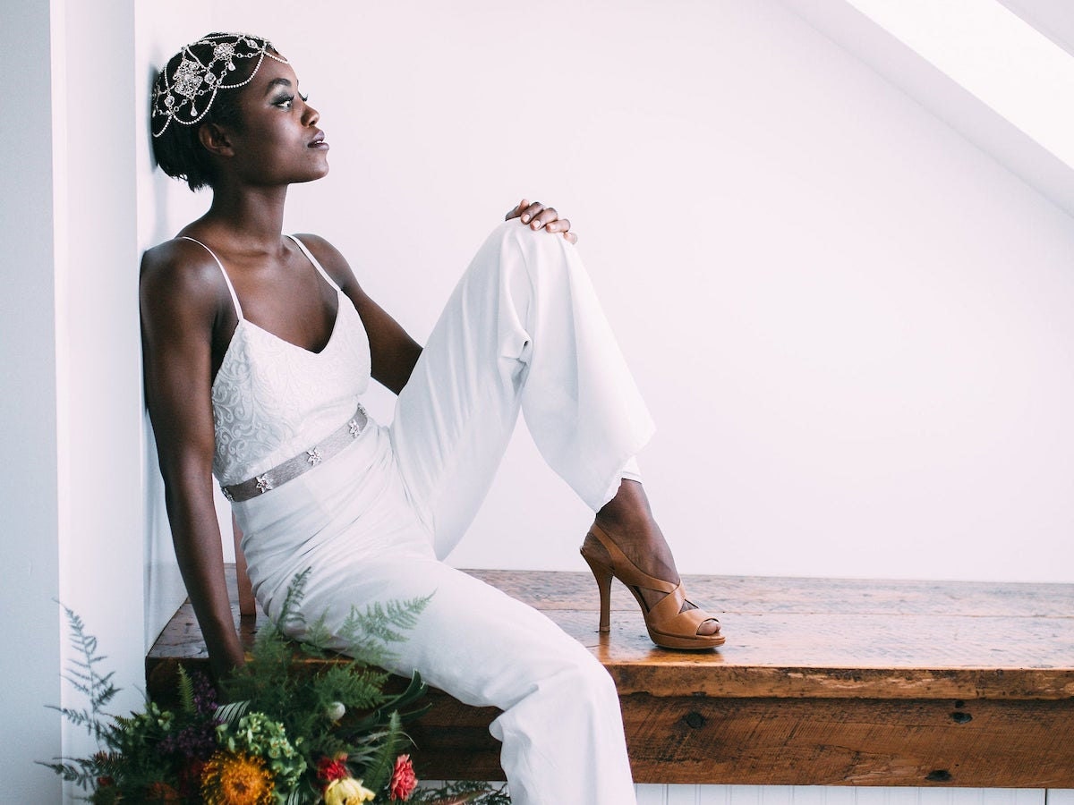 A woman models a bridal jumpsuit from Jordan de Ruiter