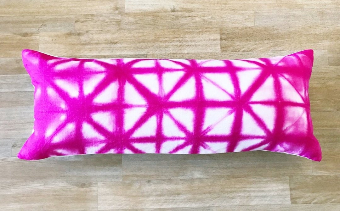 A hot pink lumbar pillow from Adroit