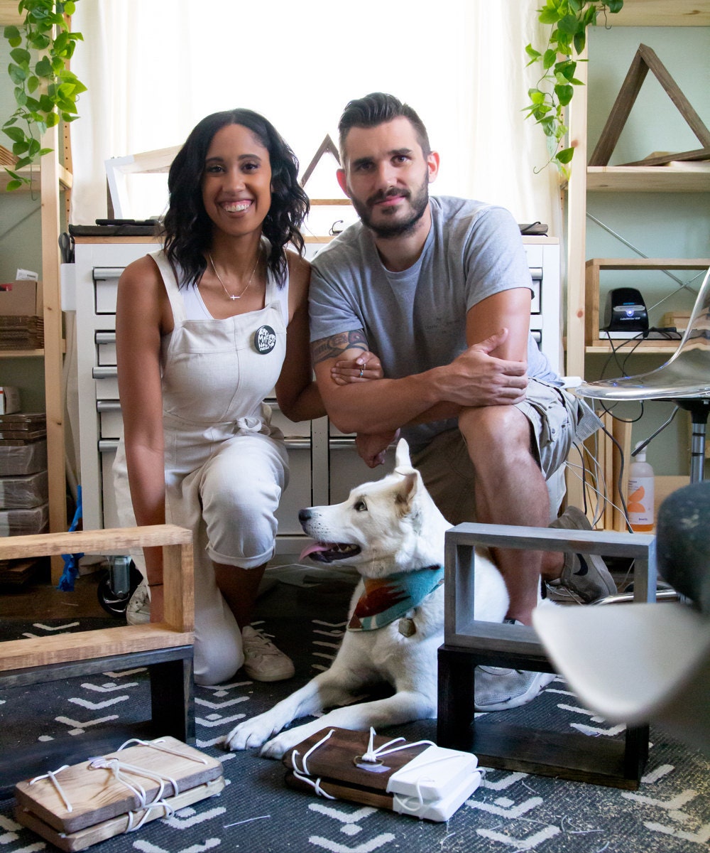 A portrait of TheCraftySwirl owner Ilana Mayes in the studio with her partner Mike and her dog Scout.