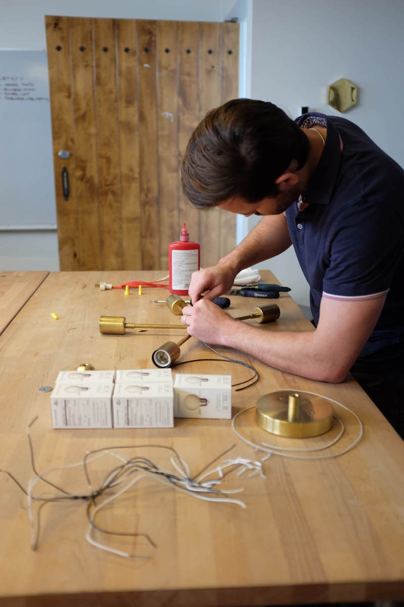 Illuminate Vintage proprietor Kyle Bostic at work in his studio