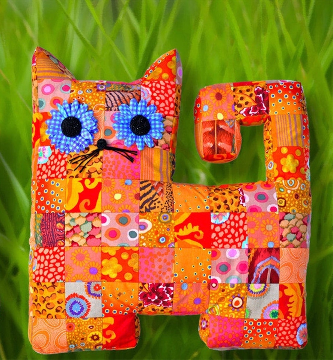 A quilted cat pillow pattern from Etsy