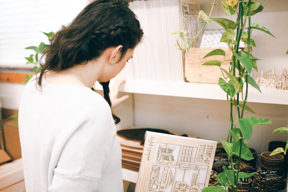 Ali sorting items in her studio.