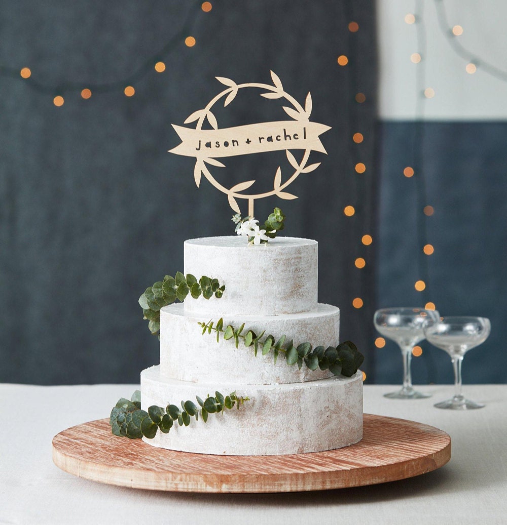 Personalized floral garland wedding cake topper from Light + Paper