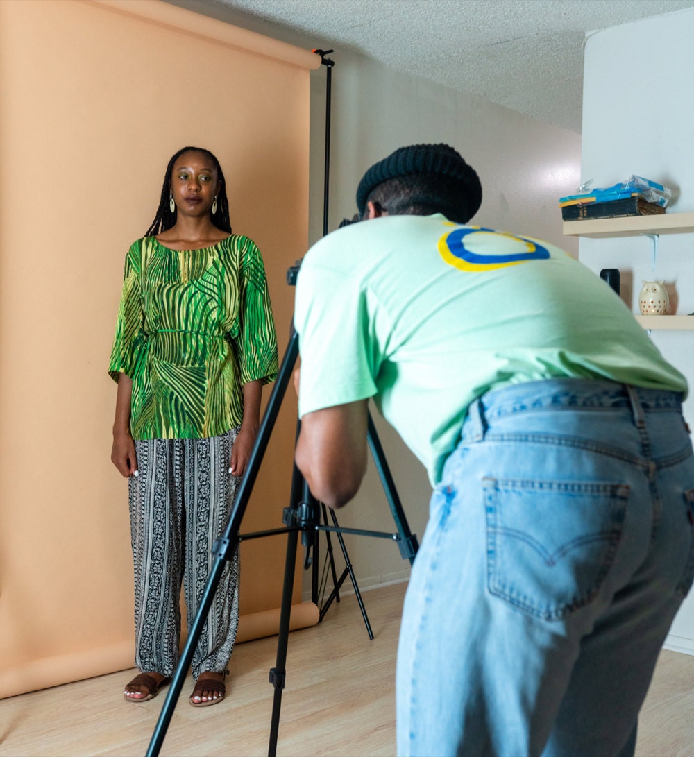 Norman photographs Rachelle modeling a vintage outfit.