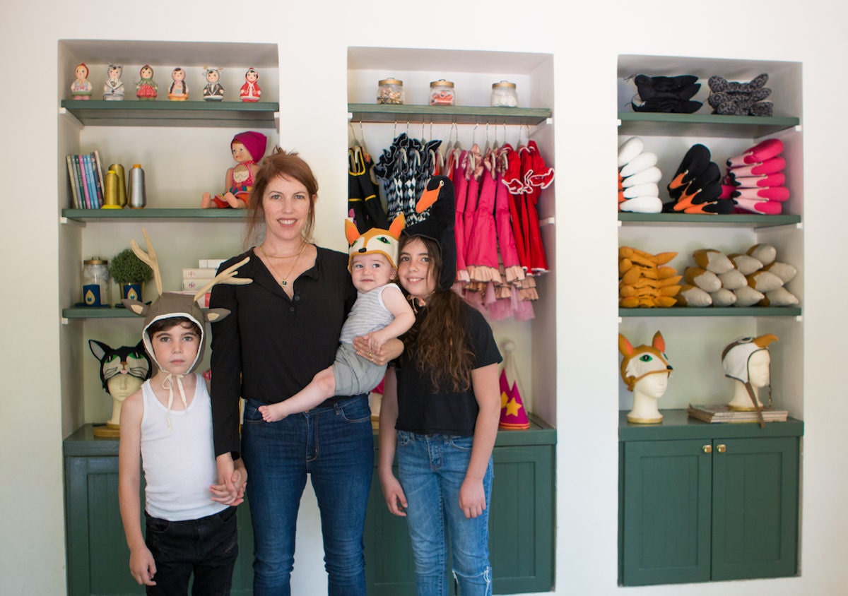 Inbal in her studio with her three children Inbal in her studio with her three children