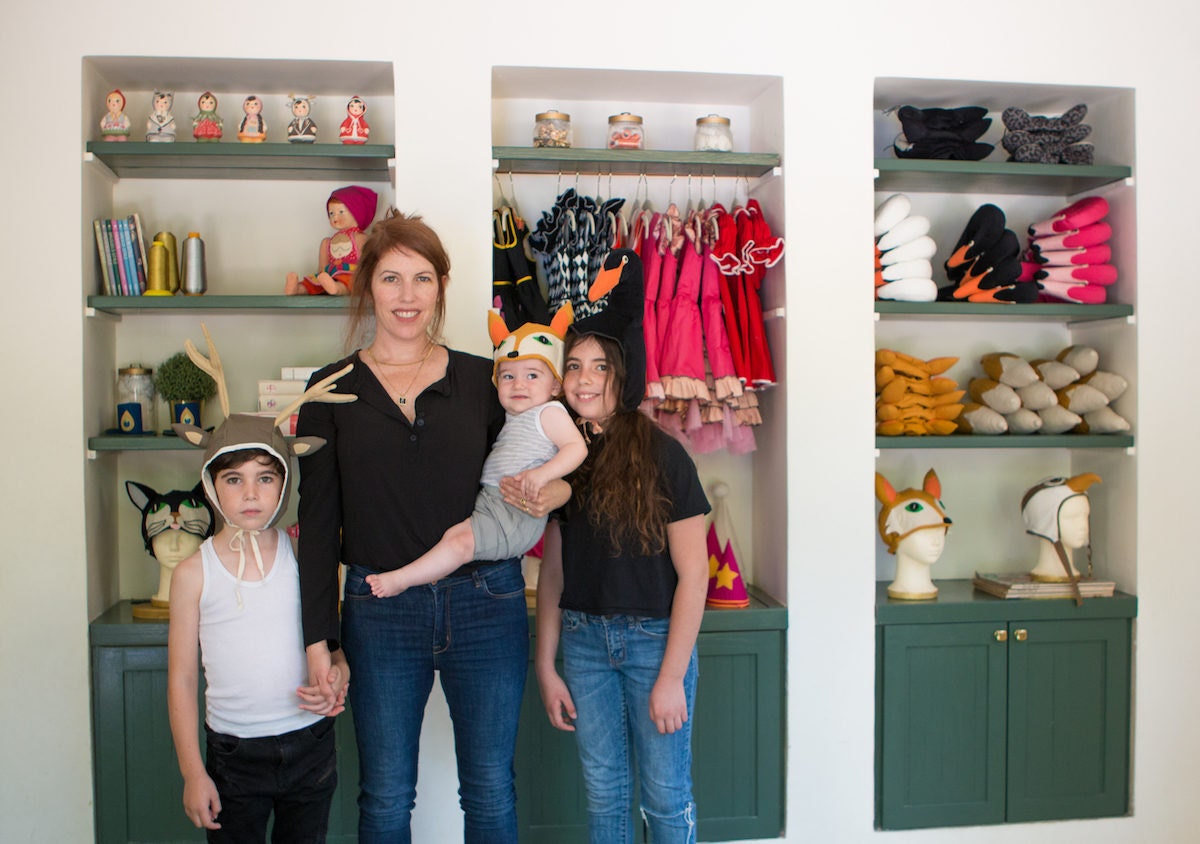 Inbal in her studio with her three children