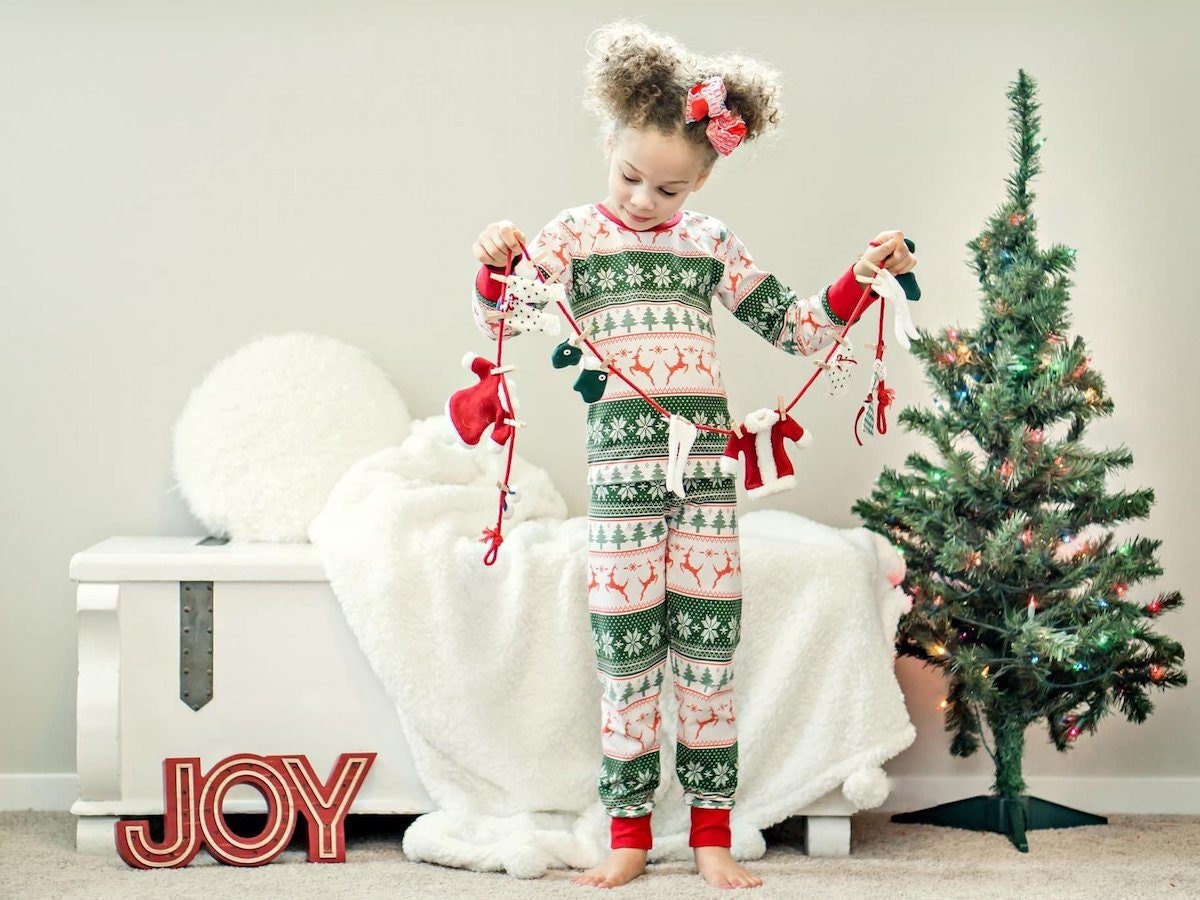 Child wearing festive pajamas from Freckles and Fancy